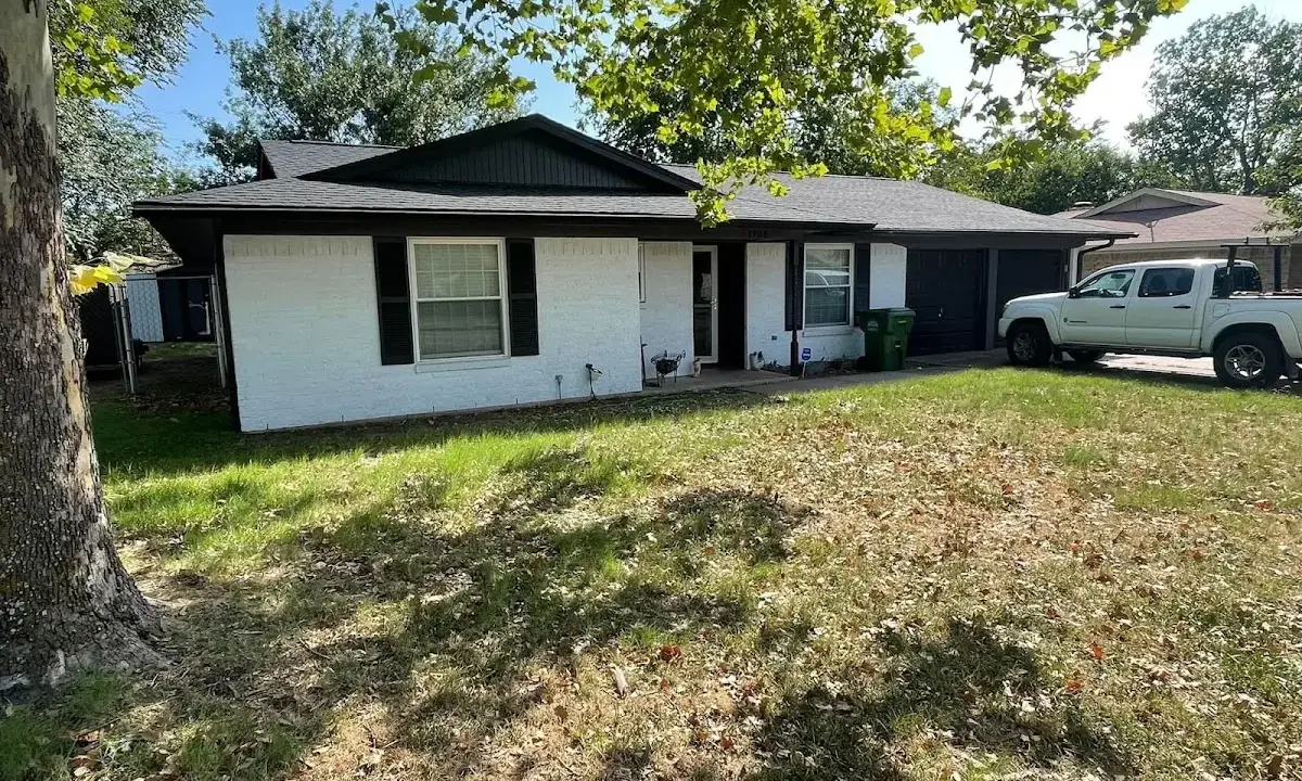 Professional roofing crew working on a residential roof in Pass Christian